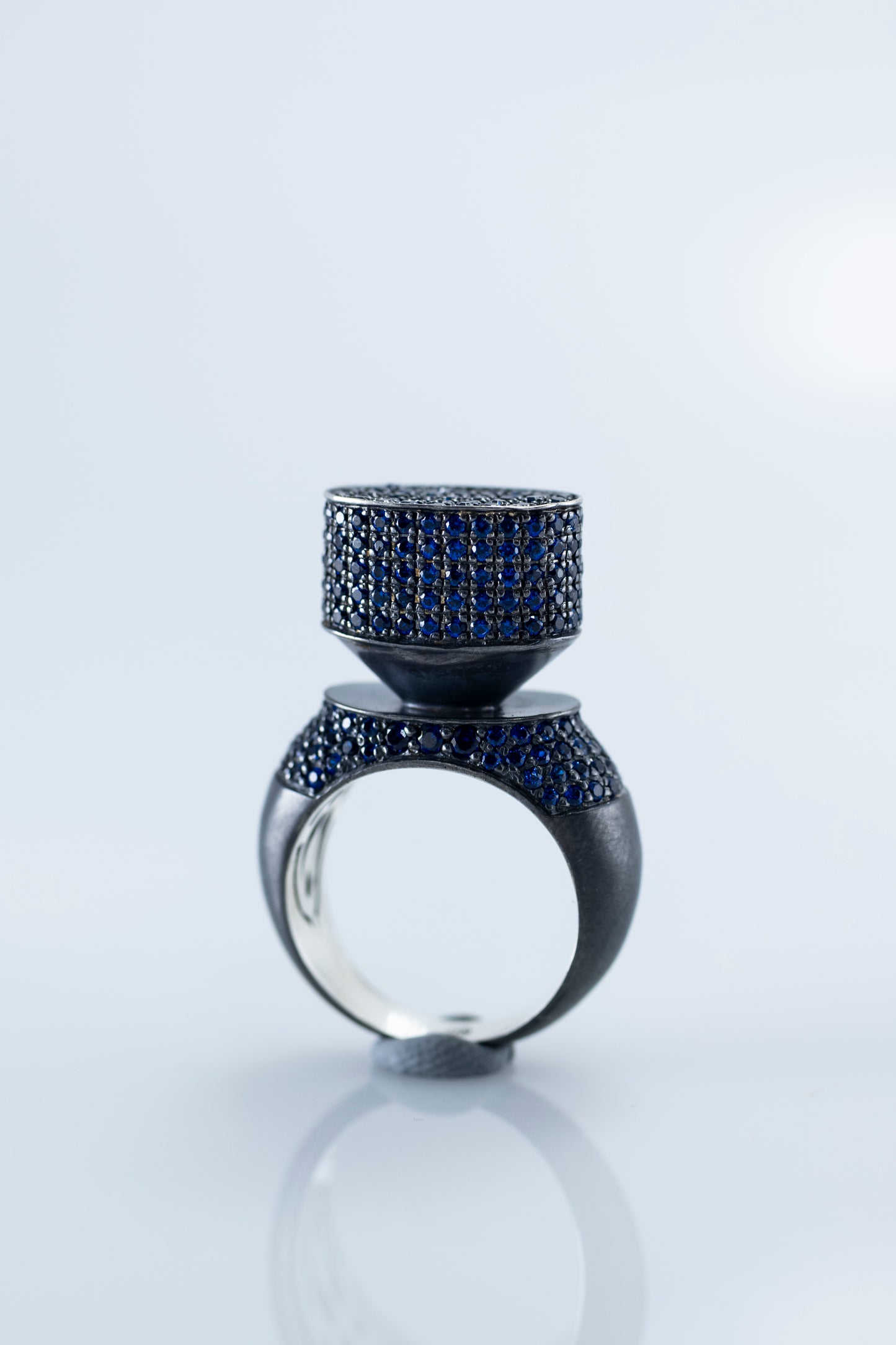 Discover Elegance with 'Blue Hormone': Modern Blackened Silver Ring with Stunning Blue Crystals