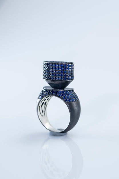 Discover Elegance with 'Blue Hormone': Modern Blackened Silver Ring with Stunning Blue Crystals