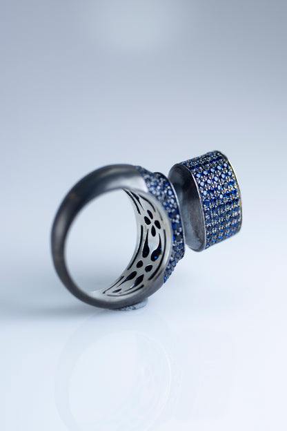 Discover Elegance with 'Blue Hormone': Modern Blackened Silver Ring with Stunning Blue Crystals