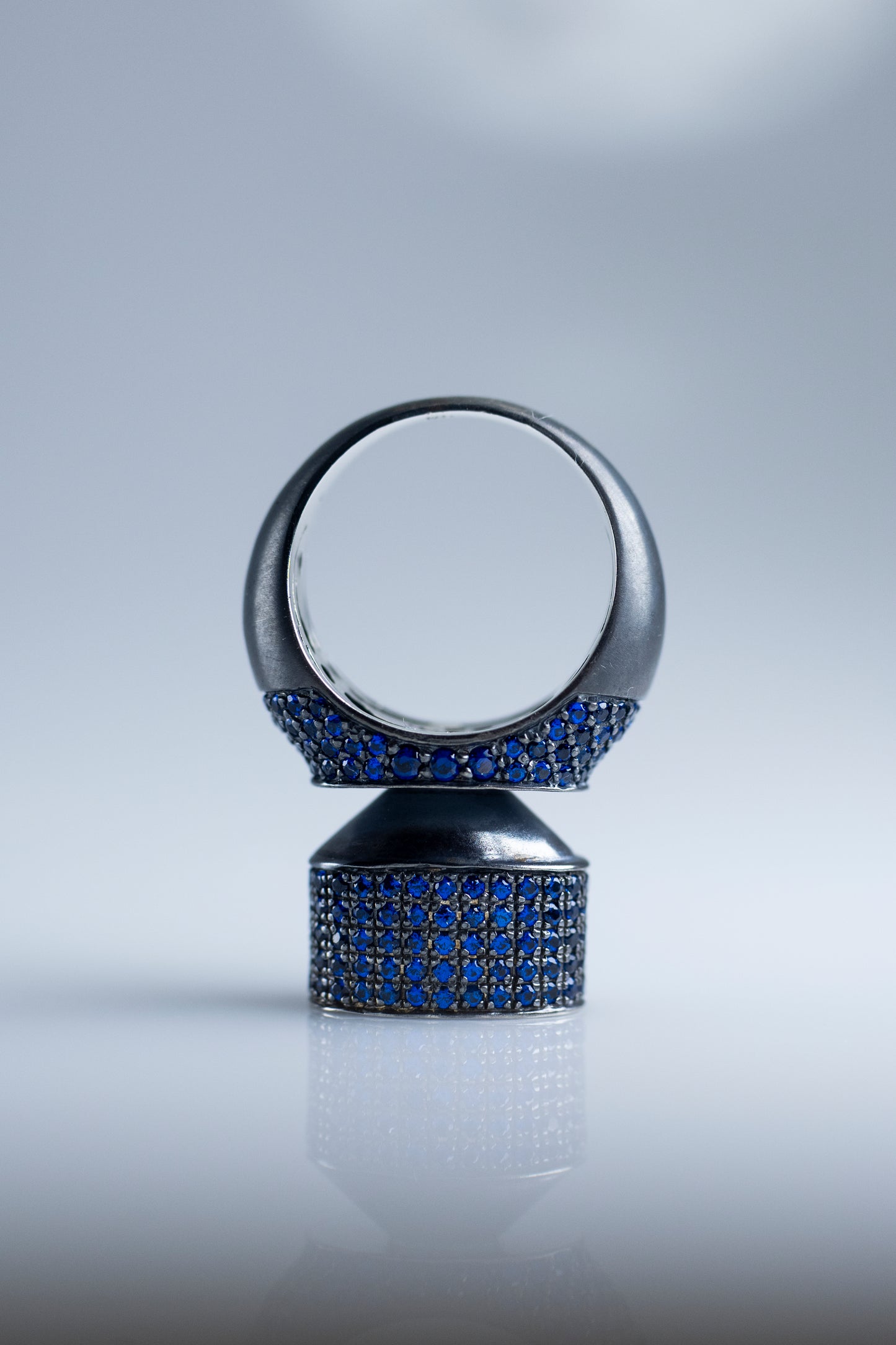 Discover Elegance with 'Blue Hormone': Modern Blackened Silver Ring with Stunning Blue Crystals